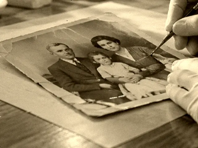 The same portrait repaired in black and white, with deep blacks back